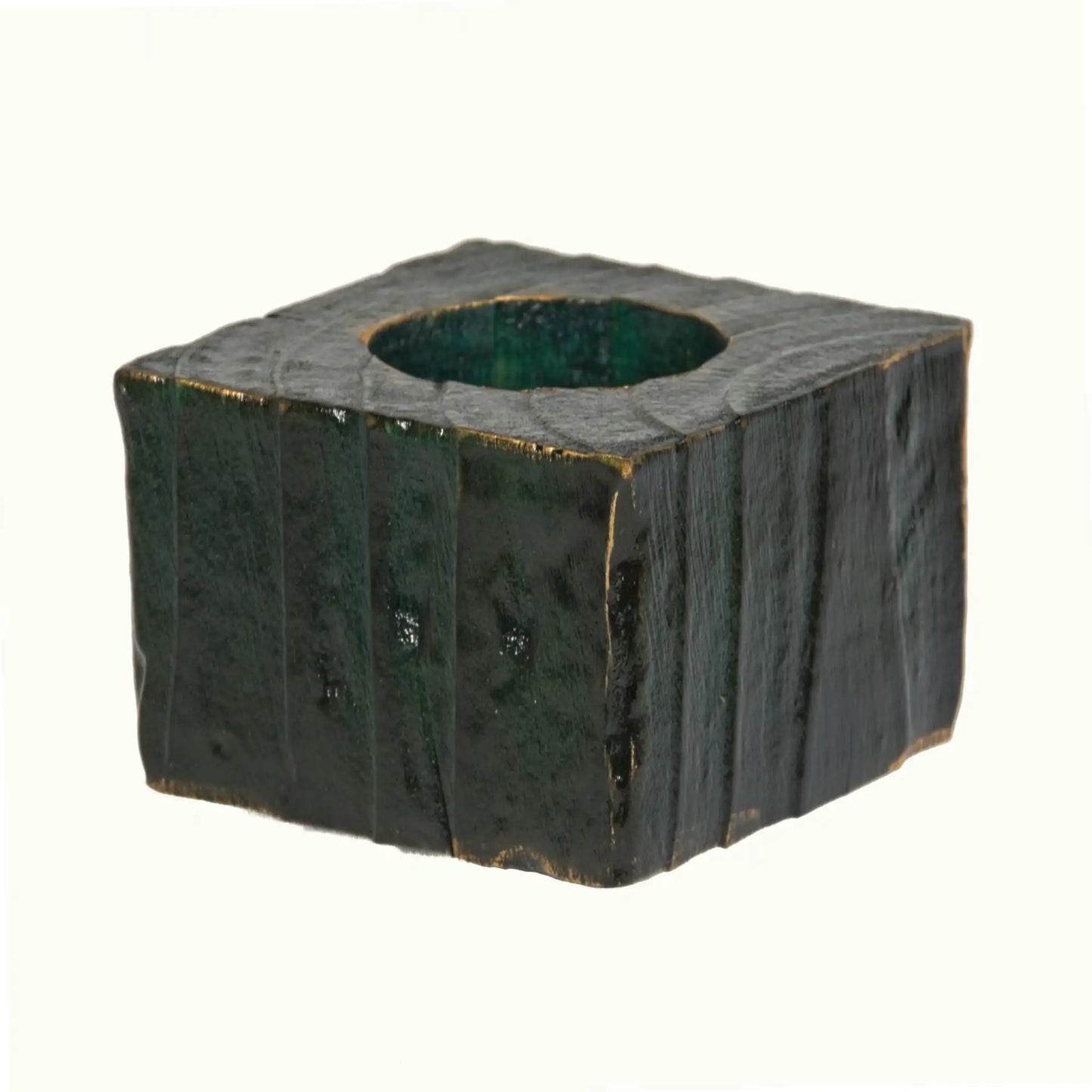 A handcrafted wooden Christmas fence post tealight holder, 50mm high and finished in green, with flashes of gold gilding paste. Shown on a white background.
