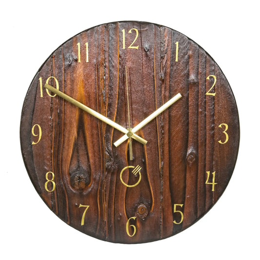 A handcrafted pallet wood wall clock, 300mm in diameter, with gold-coloured hands and gold vinyl numerals. Finished in an ochre colour and shown on a white background.