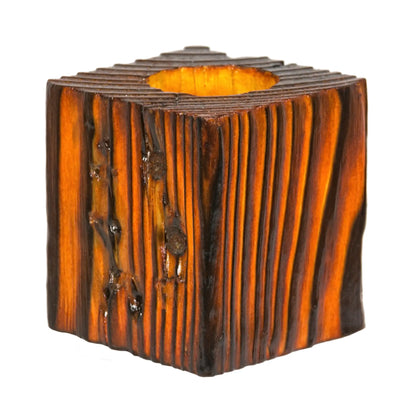 A handcrafted wooden fence post tealight holder, 70mm high and finished in a orange colour. Shown on a white background.