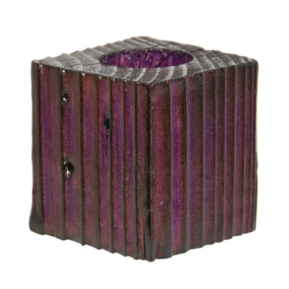 A handcrafted wooden fence post tealight holder, 70mm high and finished in a purple colour. Shown on a white background.