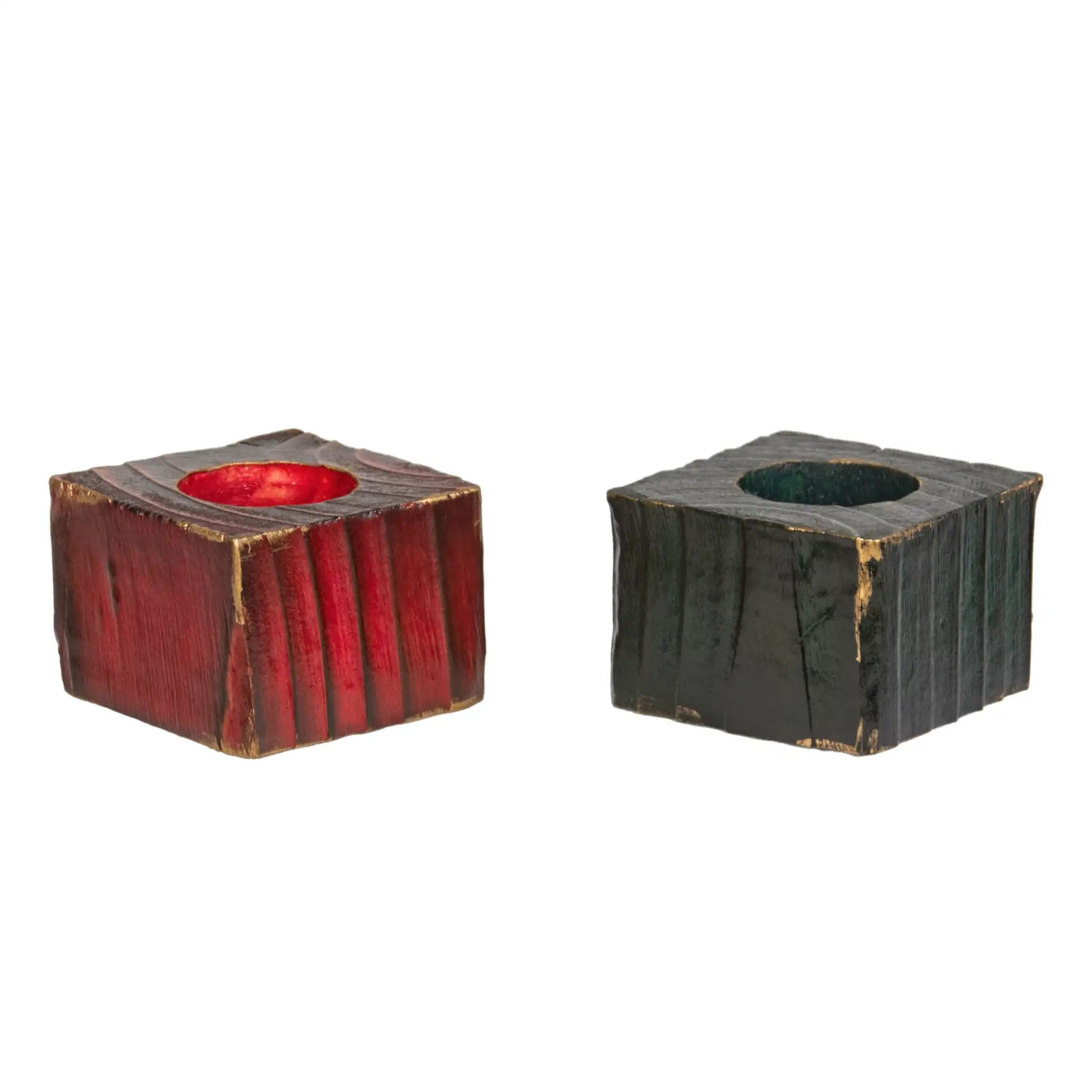 Two handcrafted wooden Christmas fence post tealight holders, 50mm high. One finished in red and the one in green. Both have flashes of gold gilding paste. Shown on a white background.