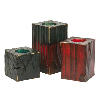 A set of 3 wooden Christmas tealight holders of different sizes. The largest has a green top. Shown on a white background.