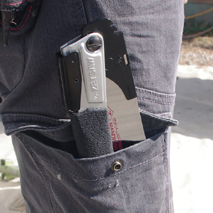 Image of the Zetsaw V Handy200 Daikume Folding Anahiki-nokogiri Japanese Saw folded and placed into the thigh pocket of a construction worker.